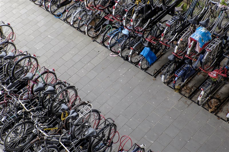 bicycles stacked on storage racks 