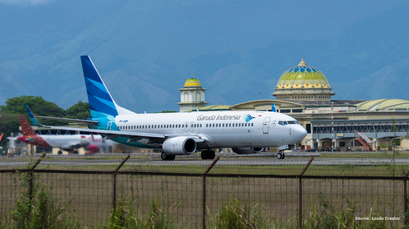 Garuda Indonesia airplane on runway at Indonesian airport